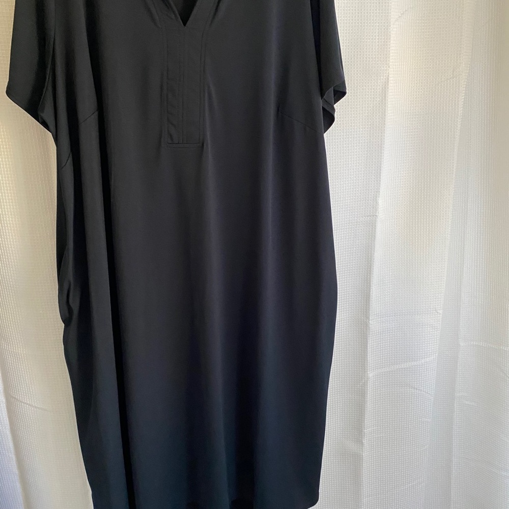 Simple black dress with pockets.